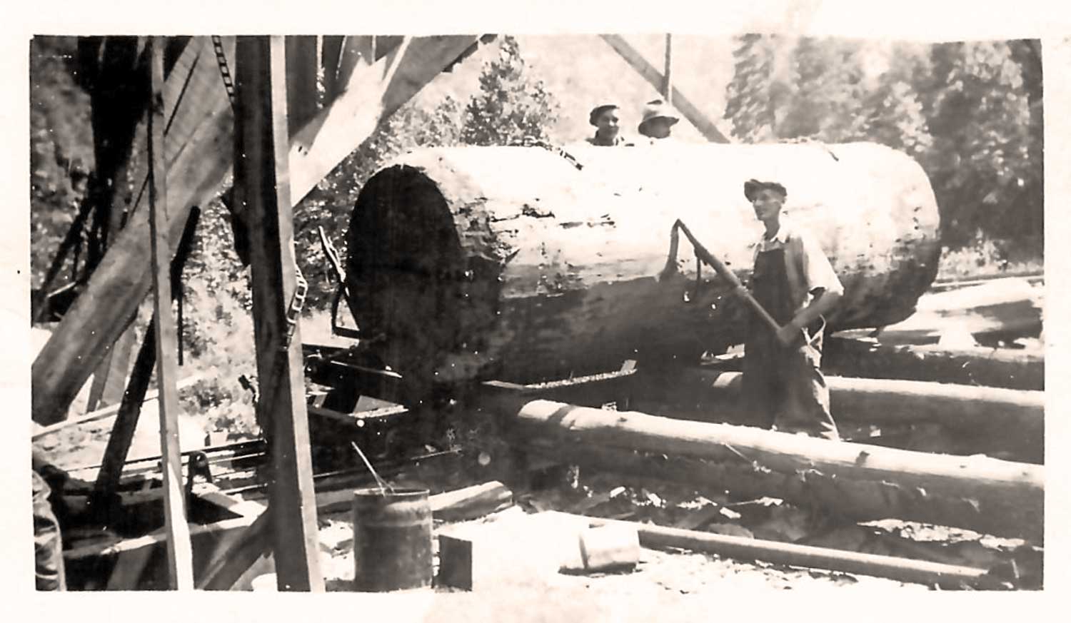 These photos are from the 1930s at the sawmill down on Elk (Triplett) that was owned by E. W. Moretz and his sons, Ralph and Glenn Moretz. The big log is a Poplar. Photo courtesy of Justin Moretz.