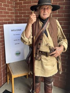 Daniel Boone (Davy Davis) greeted the members as they entered Grace Lutheran Church’s Fellowship Hall for the annual meeting.